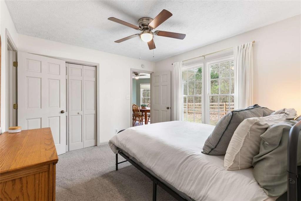 138 Adams Road Fayetteville, GA 30214 - Photo 29 of 38 a bedroom with a bed and a table
