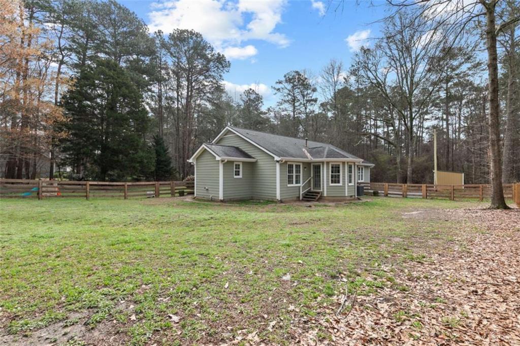 138 Adams Road Fayetteville, GA 30214 - Photo 36 of 38 a front view of a house with garden