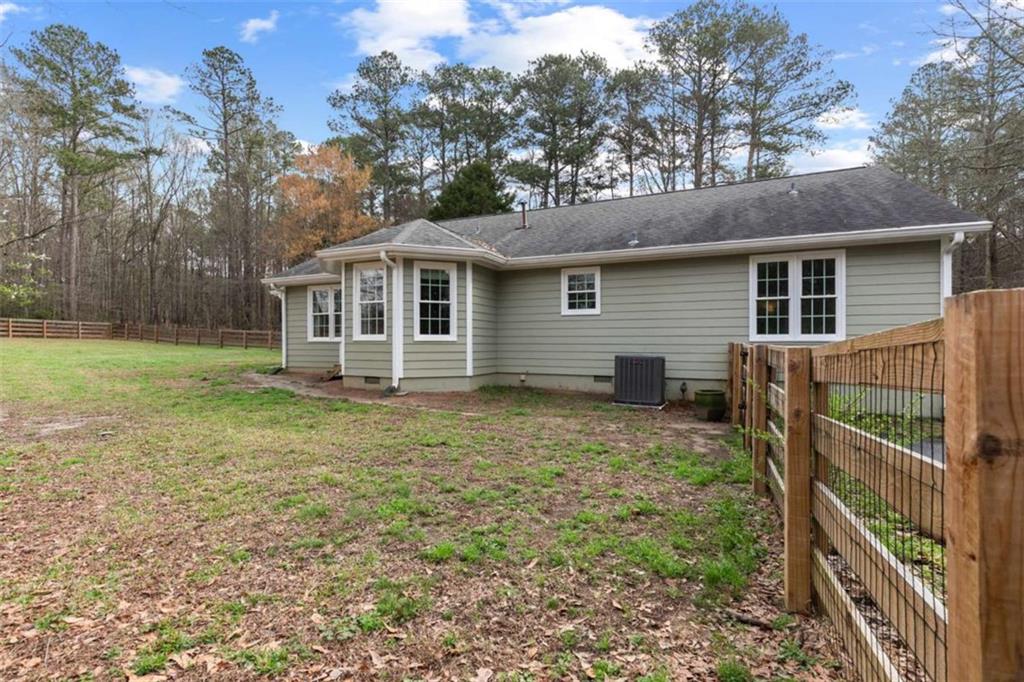 138 Adams Road Fayetteville, GA 30214 - Photo 37 of 38 a backyard of a house with lots of green space