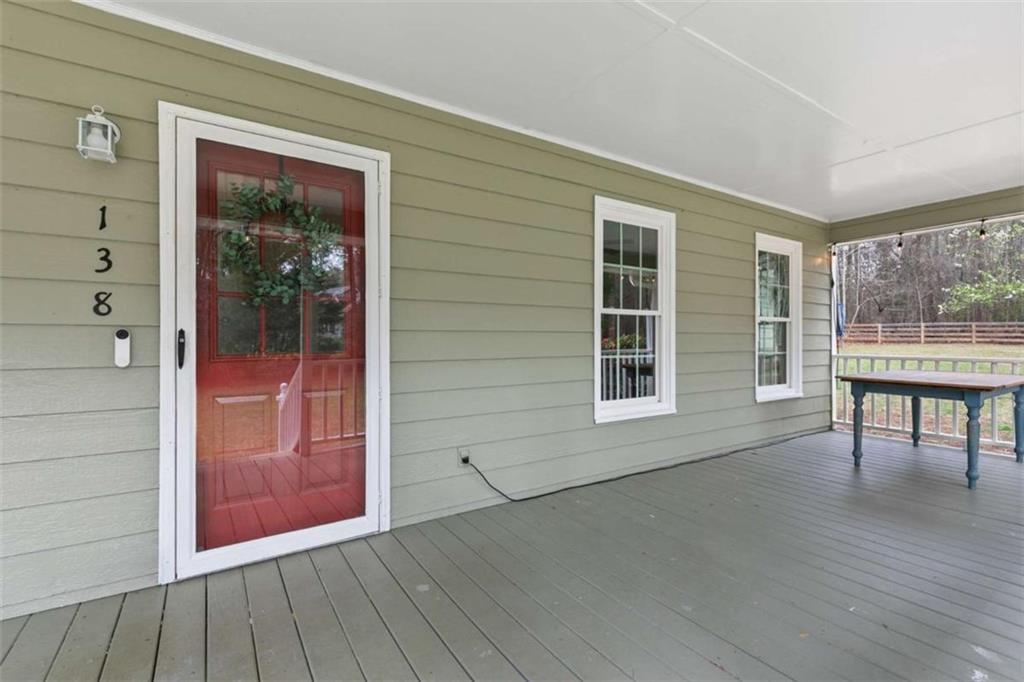 138 Adams Road Fayetteville, GA 30214 - Photo 4 of 38 an empty room with wooden floor and windows
