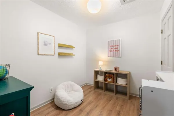 a room with furniture and wooden floor