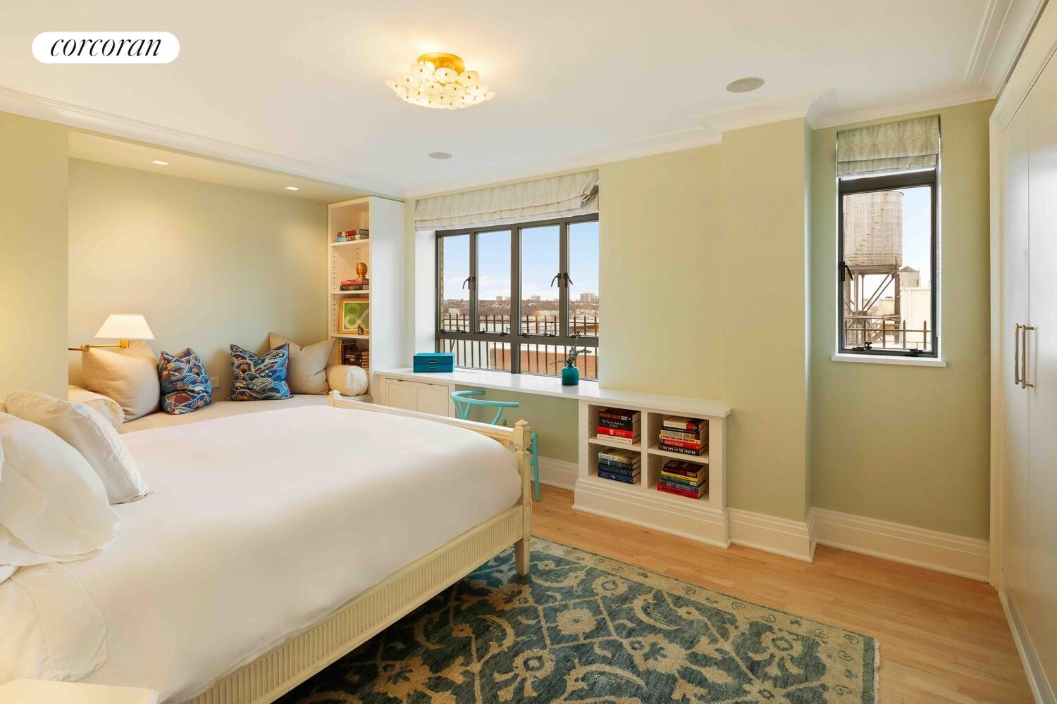 140 Riverside Drive, Unit 19HO Manhattan, NY 10024 - Photo 27 of 35 a bedroom with a bed and a large window