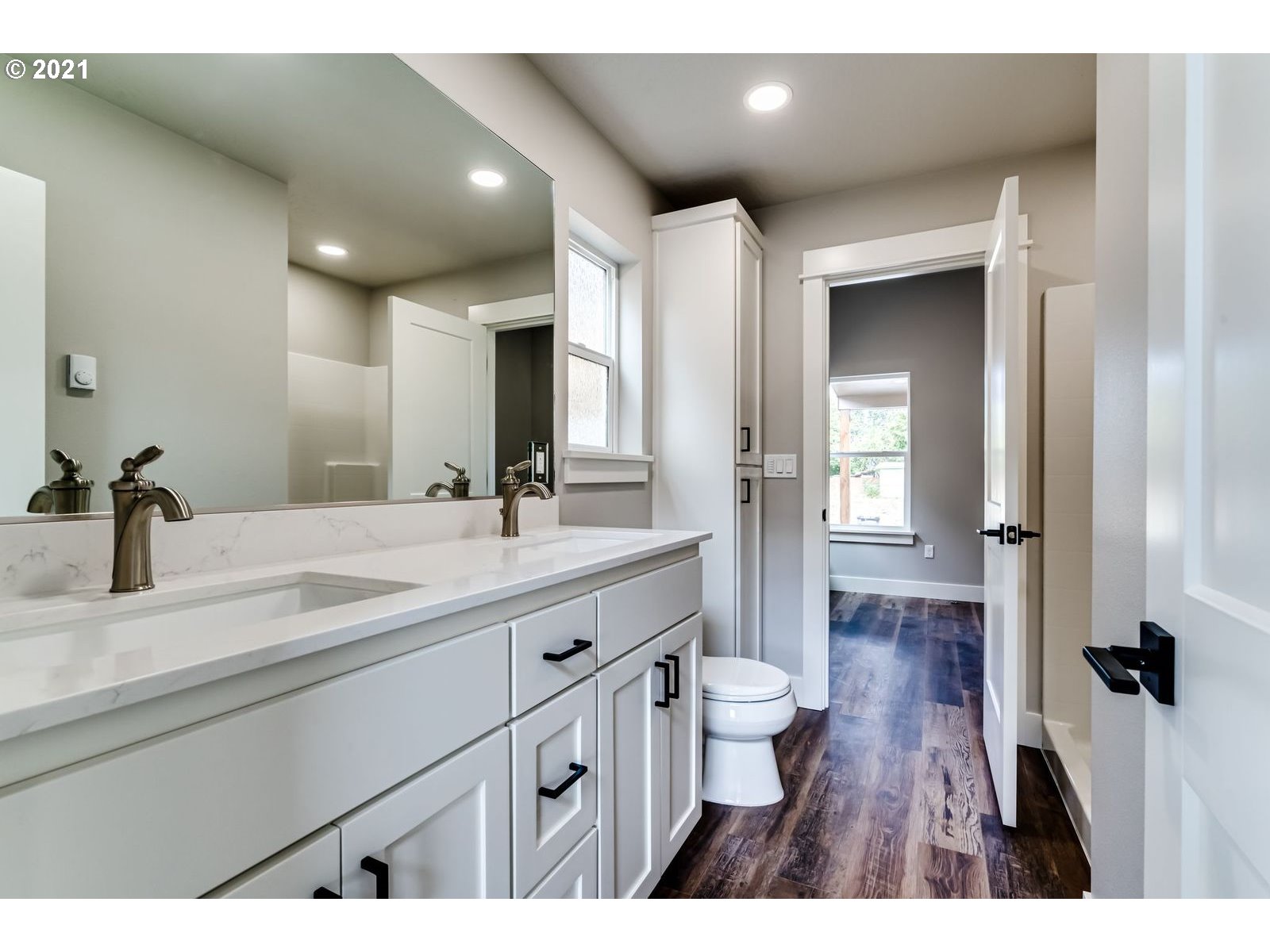 380 19th Springfield, OR 97477 - Photo 8 of 24 a bathroom with a double vanity sink and a mirror