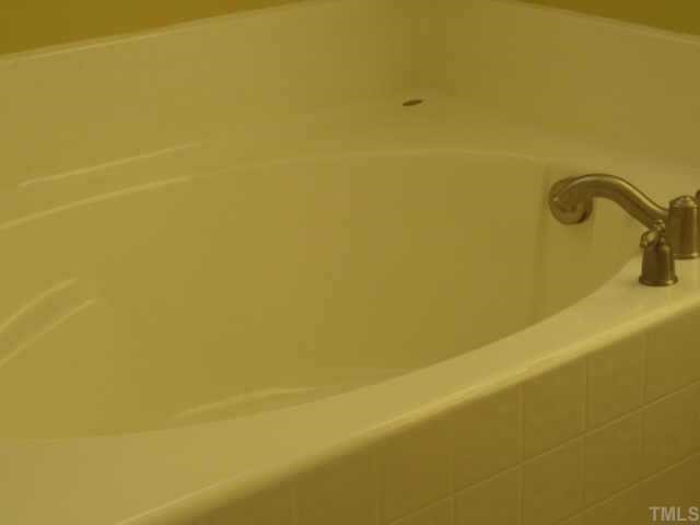 3811 Lunceston Way, Unit 307 Raleigh, NC 27613 - Photo 8 of 10 Of course this quality built condo would not be complete without the garden tub and seperate glass shower, dual vanity and italian tile floors.