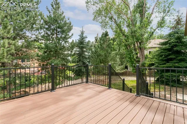 a deck view with a wooden floor and fence