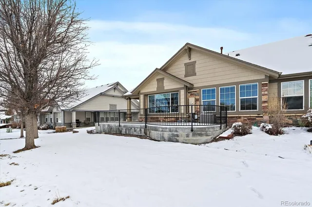 a view of a house with snow on the road