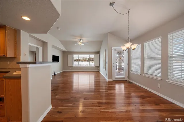 a view of a kitchen with a stove cabinets and wooden floor