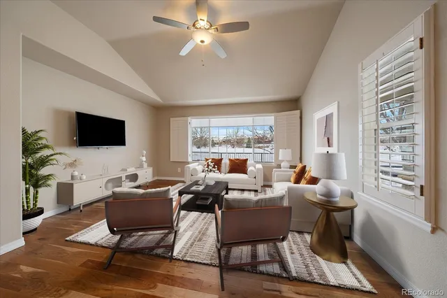 a living room with fireplace furniture and a flat screen tv