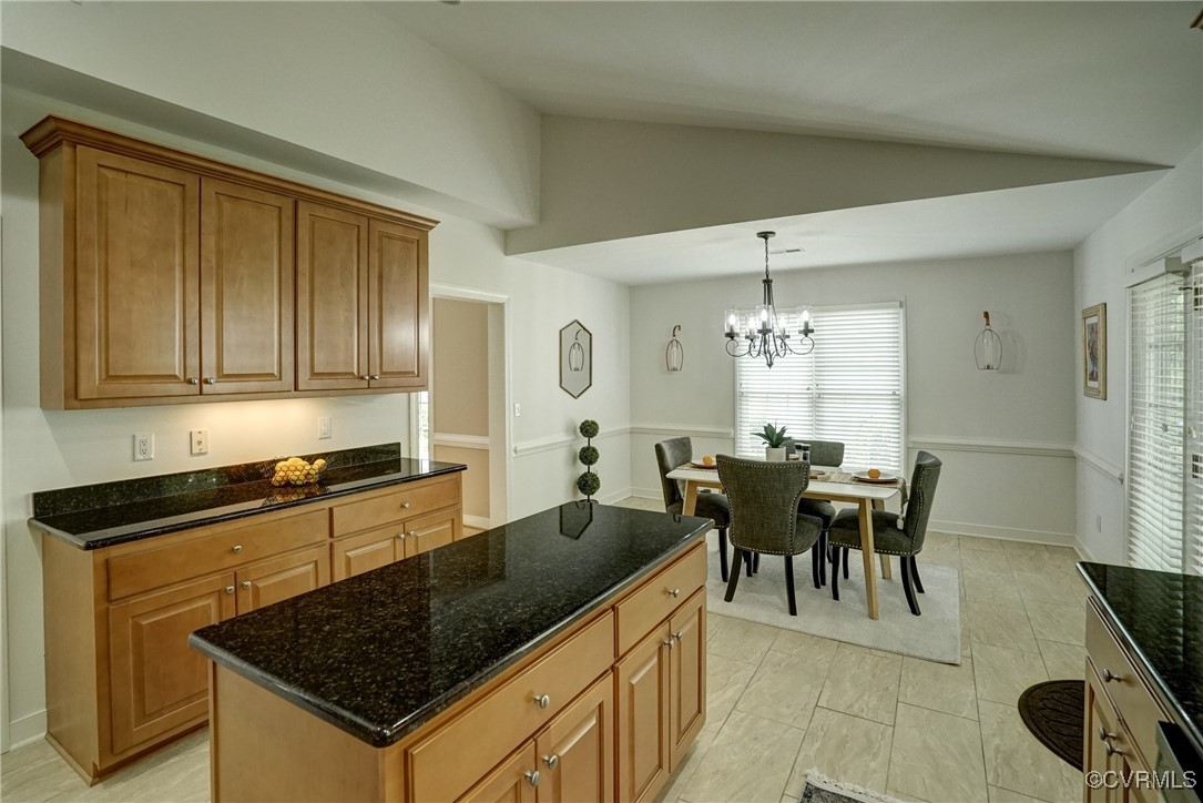 10132 Forest Patch Drive Mechanicsville, VA 23116 - Photo 11 of 43 a kitchen with a table chairs and white cabinets