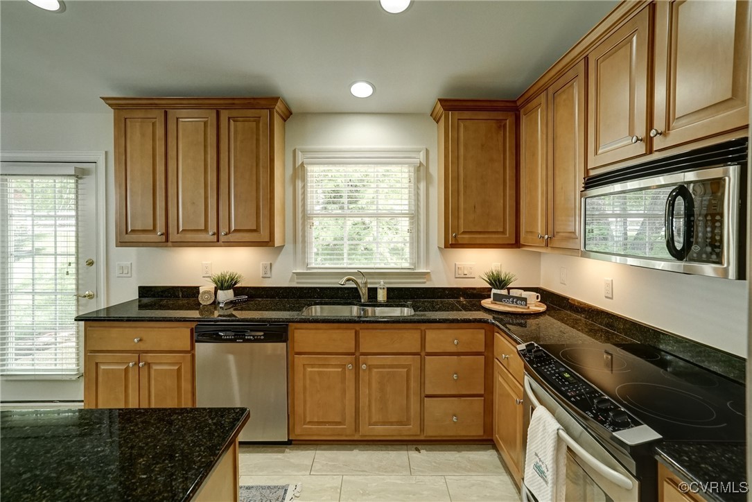 10132 Forest Patch Drive Mechanicsville, VA 23116 - Photo 12 of 43 a kitchen with granite countertop a sink a stove cabinets and stainless steel appliances