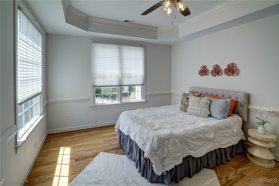 10132 Forest Patch Drive Mechanicsville, VA 23116 - Photo 28 of 43 a bedroom with a bed and a chandelier