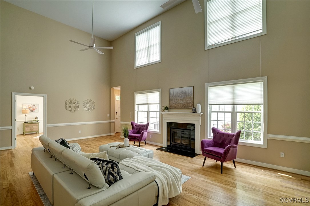 10132 Forest Patch Drive Mechanicsville, VA 23116 - Photo 5 of 43 a living room with furniture large window and a fireplace