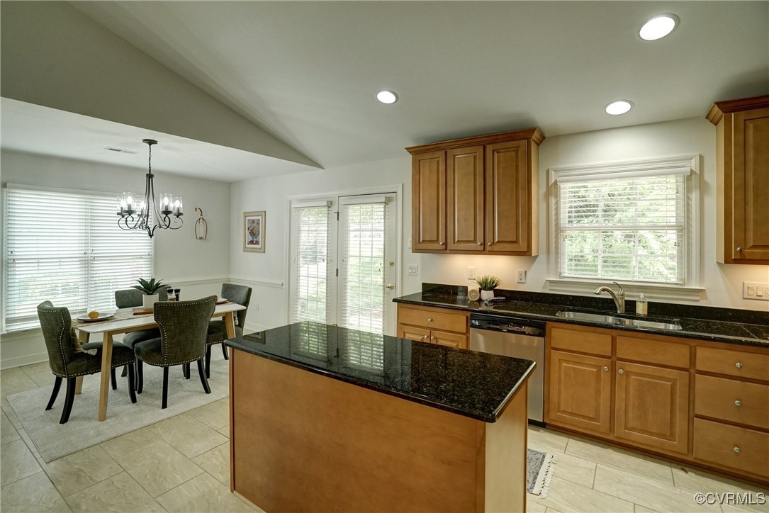 10132 Forest Patch Drive Mechanicsville, VA 23116 - Photo 10 of 43 a kitchen with granite countertop sink cabinets and dining table