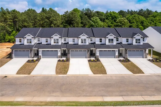 an aerial view of a house with swimming pool