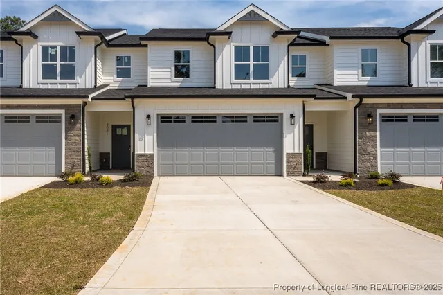 a front view of a house with yard