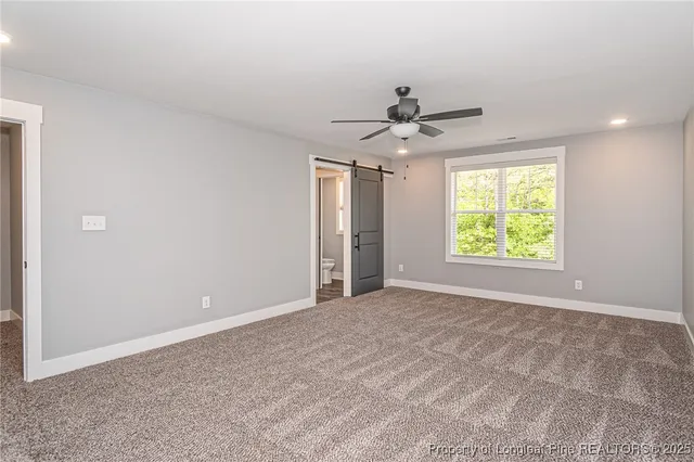 a bathroom with a granite countertop sink a mirror and shower