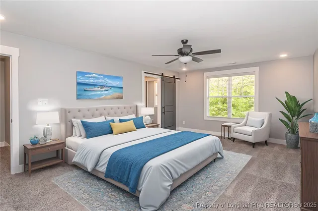 a bedroom with a bed a couch and a window