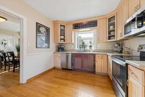 a kitchen with stainless steel appliances granite countertop a sink and cabinets