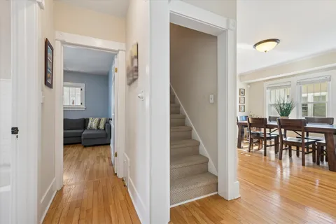 a view of a livingroom with furniture and hardwood floor