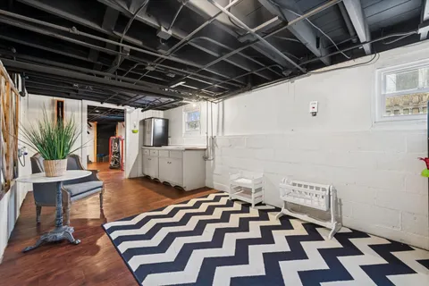 a black and white checkered floor with a rug