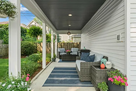 a outdoor living space with furniture and flowers