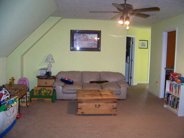 1753 Welcome Road Roopville, GA 30170 - Photo 1 of 1 a living room with furniture and a flat screen tv