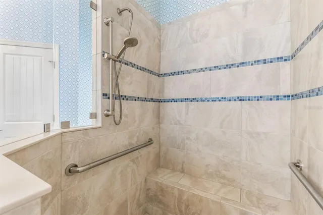 a bathroom with a shower and a shower
