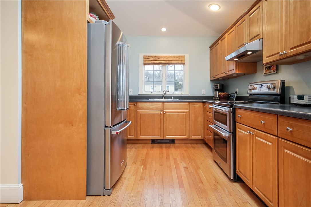 55 What Cheer Road Narragansett, RI 02882 - Photo 8 of 20 Kitchen with hardwood floors, stainless steel appliances and tons of counter space! Note the range has double oven!