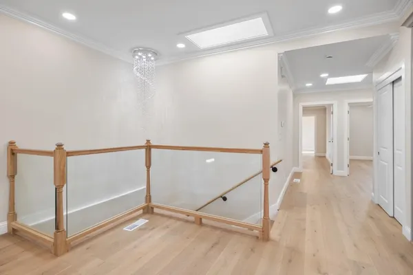 a view of a hallway with staircase