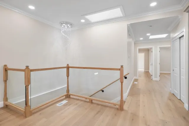 a view of a hallway with staircase