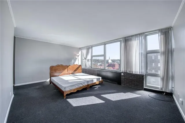 a bedroom with furniture and wooden floor