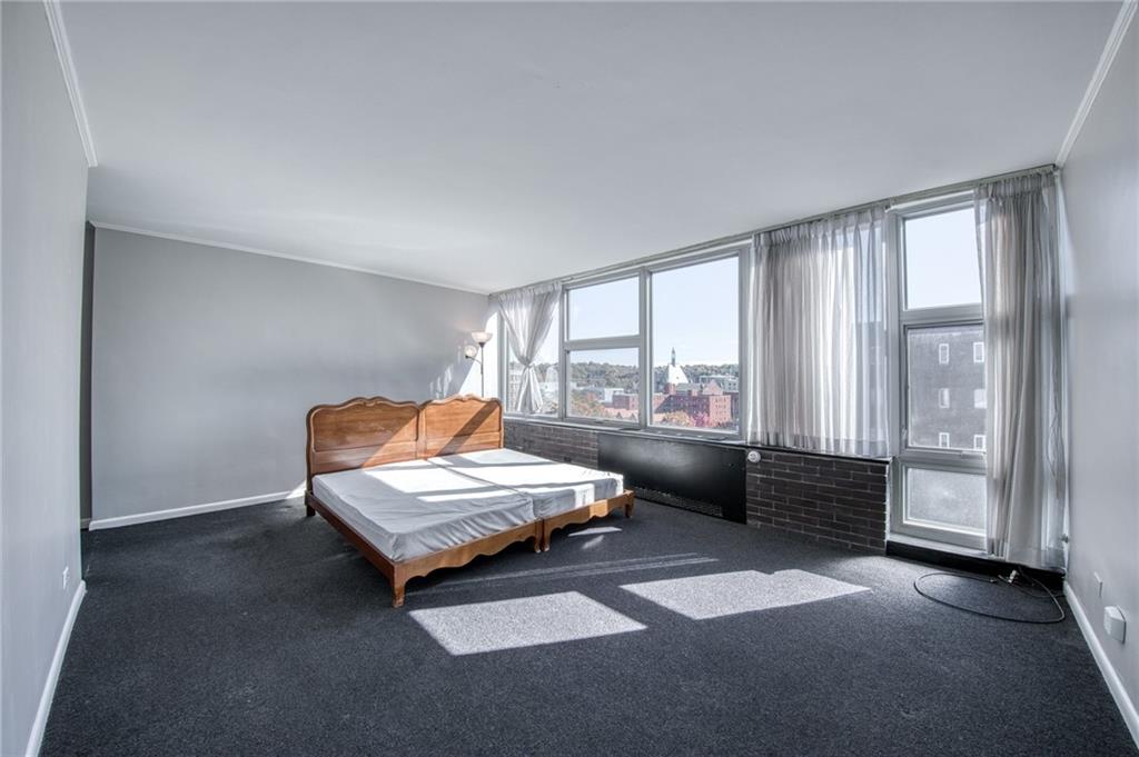 552 North Neville Street, Unit PH2 Pittsburgh, PA 15213 - Photo 13 of 42 a living room with furniture and large windows
