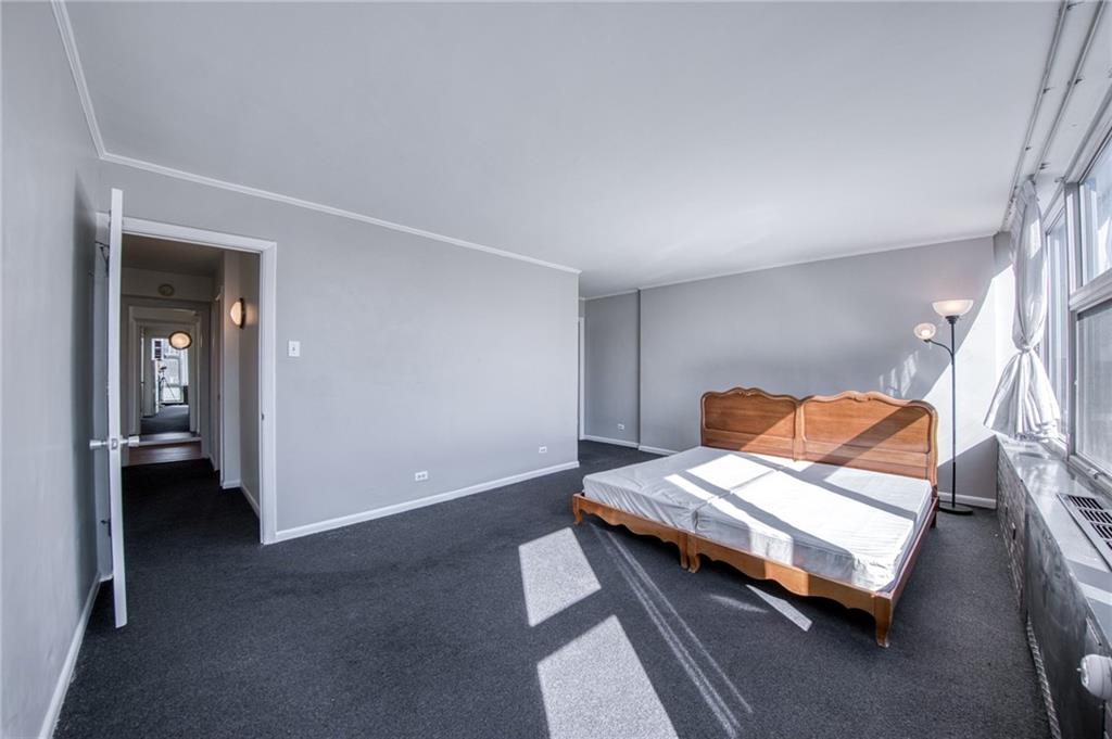 552 North Neville Street, Unit PH2 Pittsburgh, PA 15213 - Photo 14 of 42 a bedroom with furniture and wooden floor