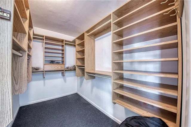 a bathroom with a toilet a sink and a mirror