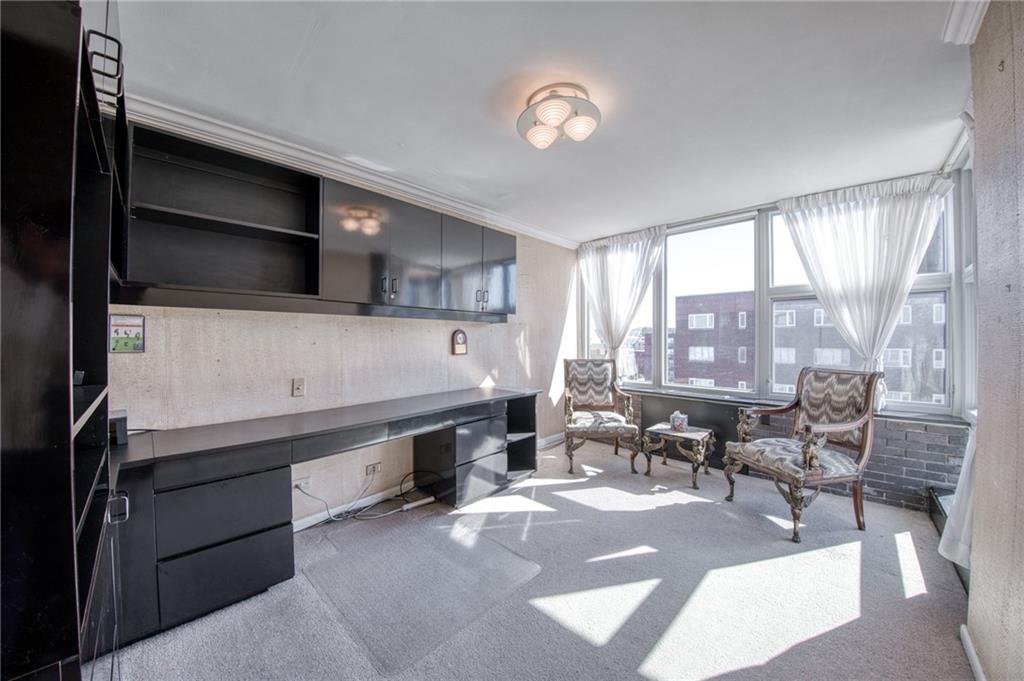 552 North Neville Street, Unit PH2 Pittsburgh, PA 15213 - Photo 22 of 42 a living room with stainless steel appliances kitchen island granite countertop furniture and a fireplace