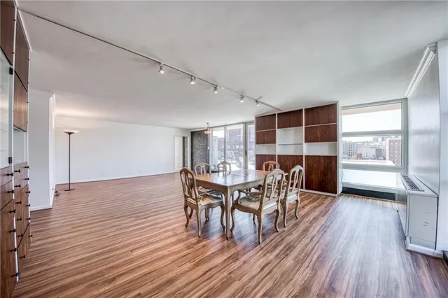 a view of a dining room with furniture and wooden floor