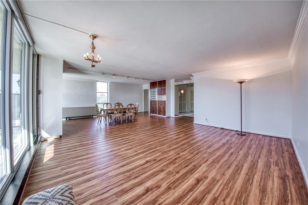 552 North Neville Street, Unit PH2 Pittsburgh, PA 15213 - Photo 7 of 42 a view of a livingroom with furniture wooden floor ceiling fan and windows