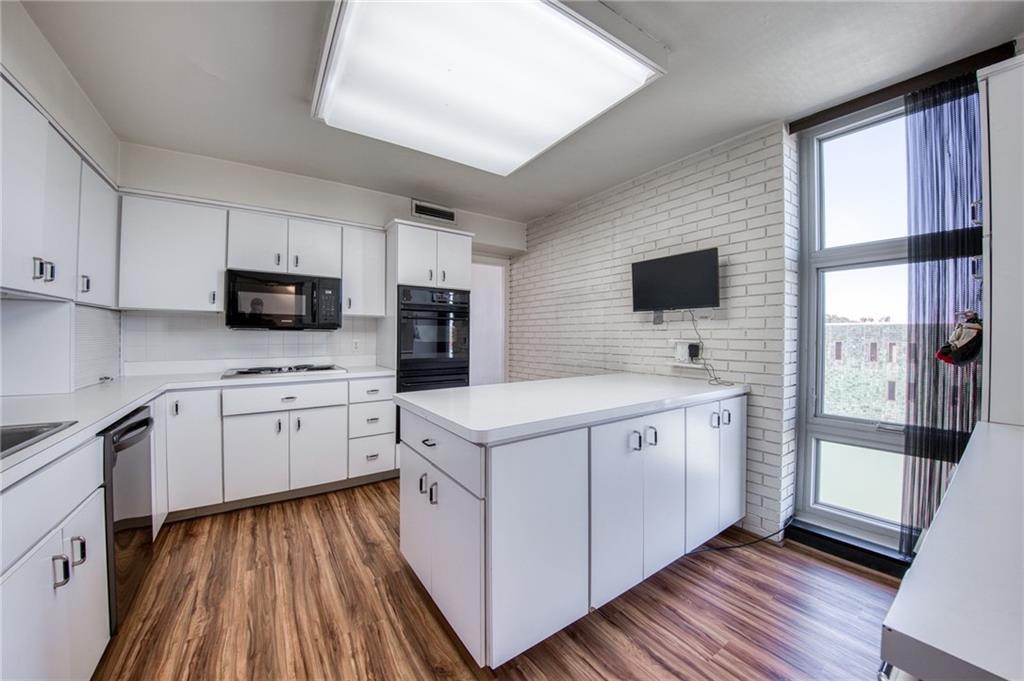 552 North Neville Street, Unit PH2 Pittsburgh, PA 15213 - Photo 9 of 42 a kitchen with white cabinets and white appliances