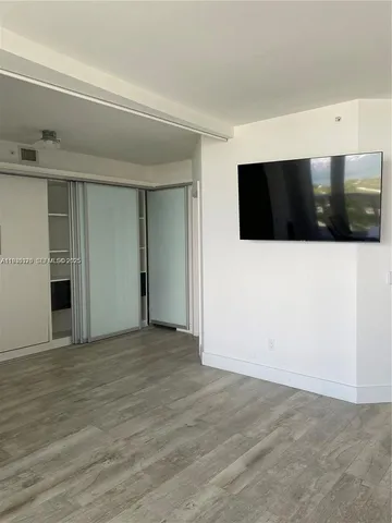 a view of a livingroom with a flat screen tv