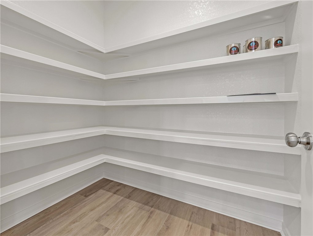 2776 Messenger Way Bryan, TX 77803 - Photo 6 of 16 a view of a closet with wooden floor