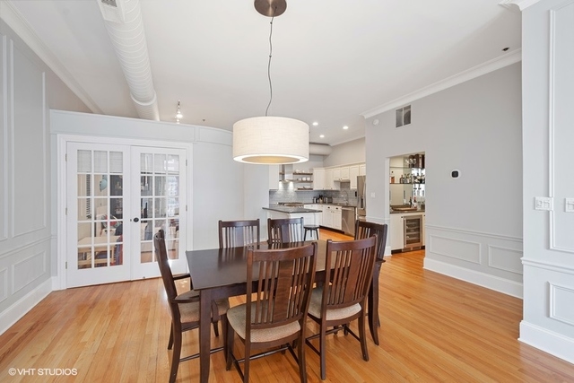 1016 West Madison Street, Unit 3S Chicago, IL 60607 - Photo 12 of 22 a view of a dining room with furniture window and wooden floor