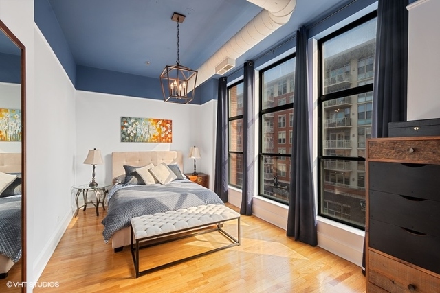 1016 West Madison Street, Unit 3S Chicago, IL 60607 - Photo 13 of 22 a bedroom with a bed dresser and a window