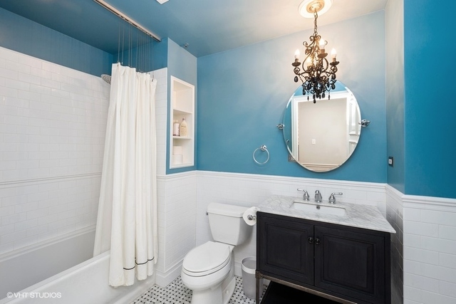 1016 West Madison Street, Unit 3S Chicago, IL 60607 - Photo 19 of 22 a bathroom with a toilet sink and mirror