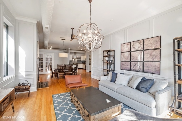 1016 West Madison Street, Unit 3S Chicago, IL 60607 - Photo 6 of 22 a living room with furniture dining table and a chandelier