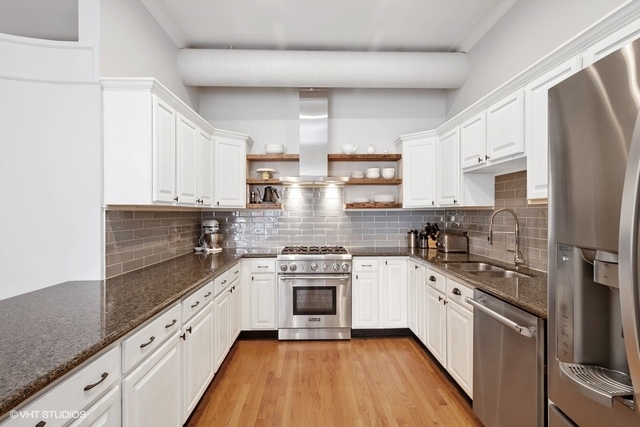 1016 West Madison Street, Unit 3S Chicago, IL 60607 - Photo 7 of 22 a kitchen with stainless steel appliances granite countertop white cabinets a sink a stove a refrigerator and white cabinets