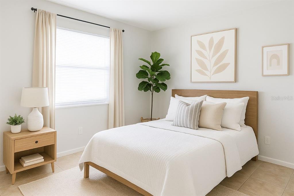 1217 Kennedy Road, Unit 56 Daytona Beach, FL 32117 - Photo 6 of 9 a bedroom with a bed and a window