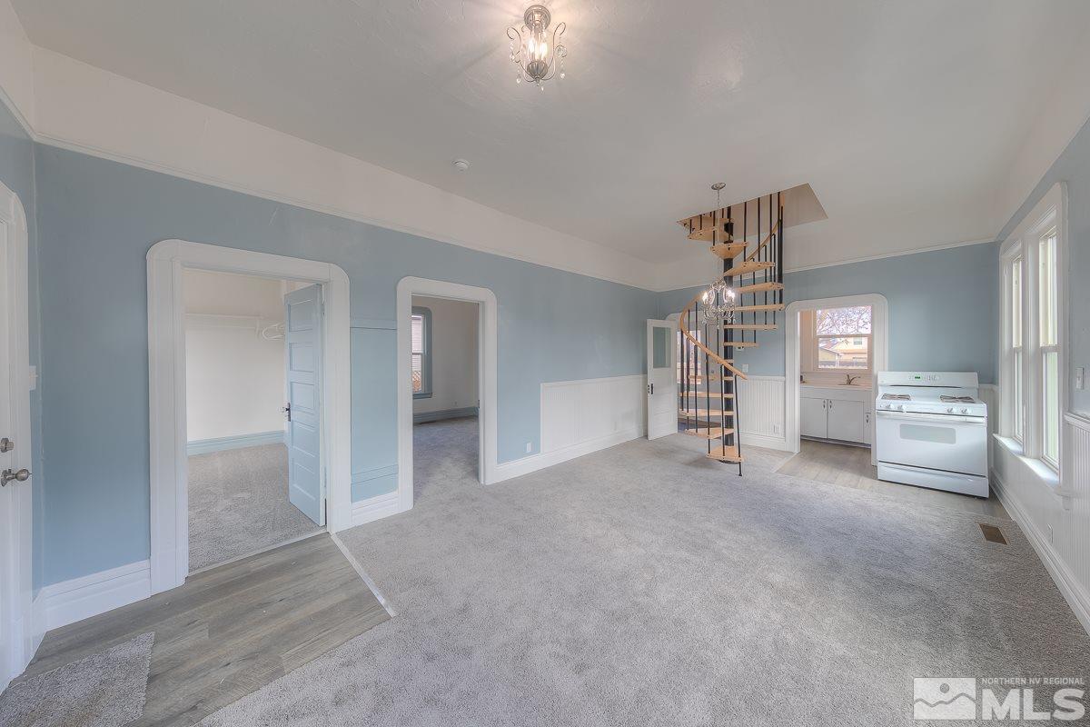 614 Elko Avenue Reno, NV 89512 - Photo 3 of 24 a view of empty room with windows and fireplace