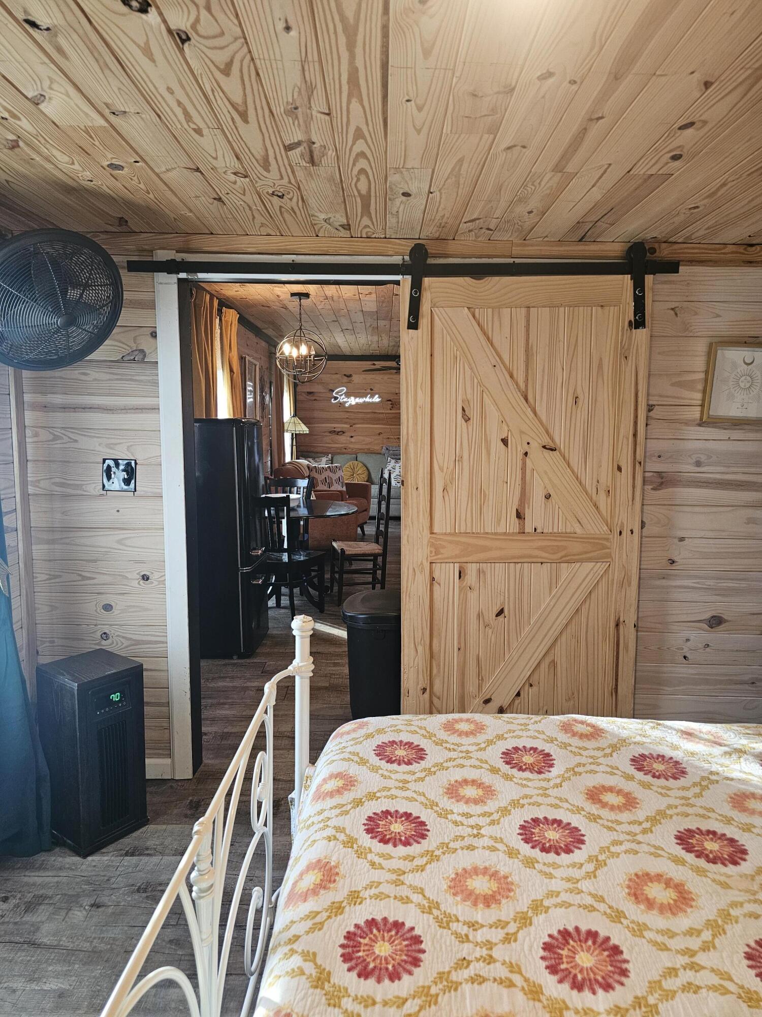 49 Hays Hollow Road Flintstone, GA 30725 - Photo 23 of 38 Bedroom 2 with barn door to living area