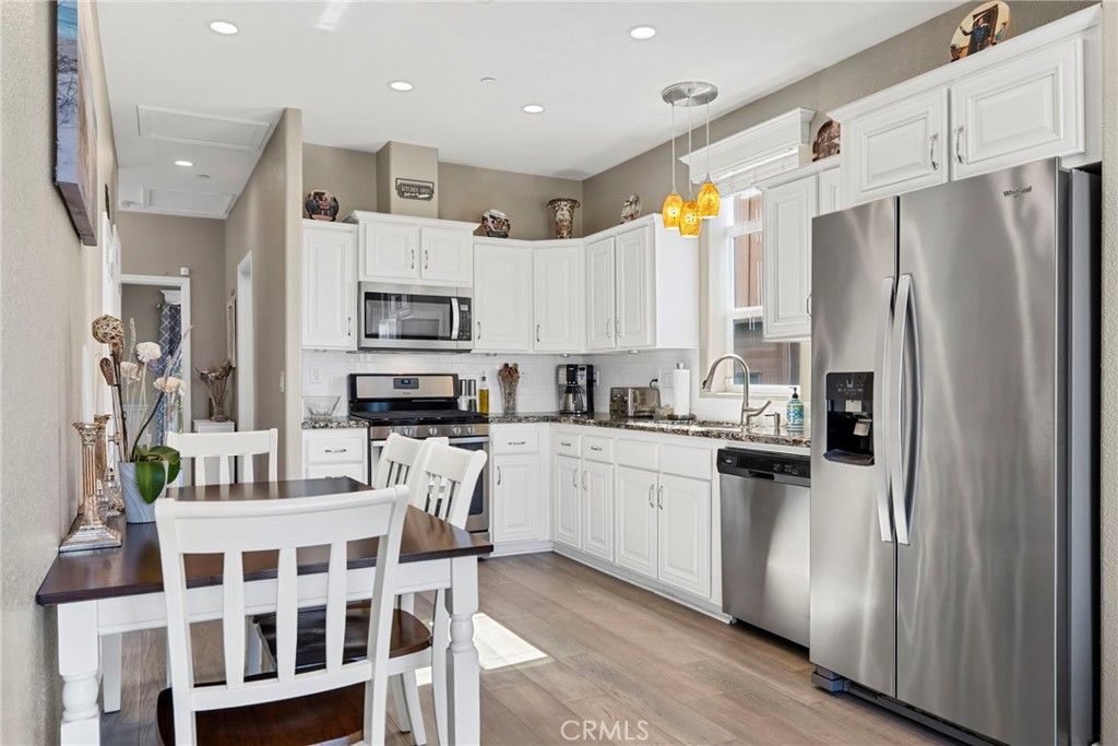 48 Riversea Road Seal Beach, CA 90740 - Photo 15 of 34 a kitchen with stainless steel appliances a refrigerator sink and microwave