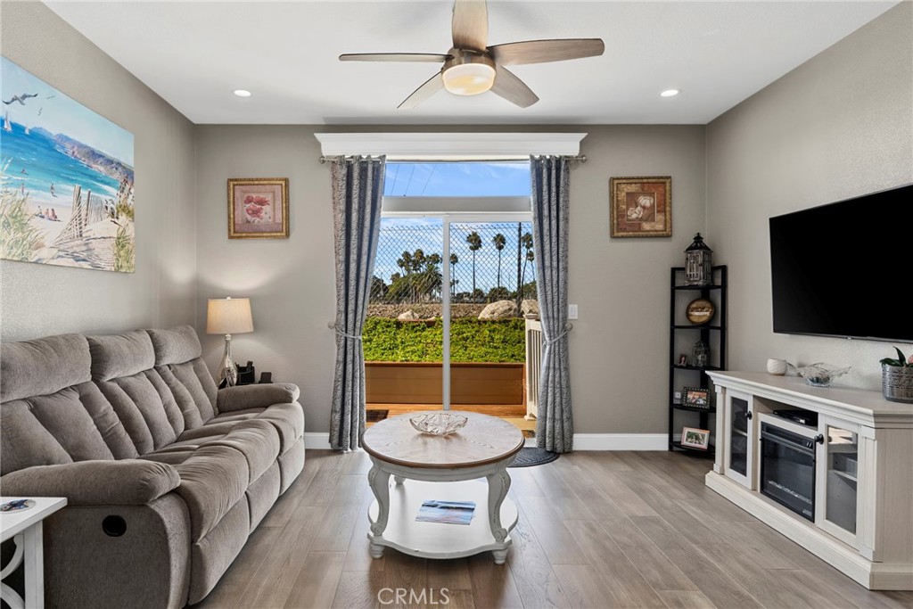 48 Riversea Road Seal Beach, CA 90740 - Photo 17 of 34 a living room with furniture and a flat screen tv